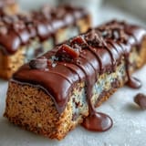 Chewy, buttery cookie bars studded with rainbow candies and chocolate chips, finished with a decadent white chocolate drizzle for a party-ready treat.  